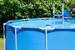 An above ground pool with a ladder. 