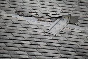 a few shingles ripped off of a roof