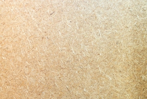 Close-up on the texture of a piece of particle board.