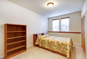 A closet with bifold doors.