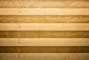 A set of horizontal blinds made from fabric.