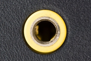 An ordinary auxiliary port with a yellow rim.