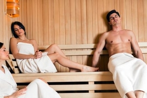 A man and a woman in a sauna.