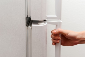 person about to open refrigerator door