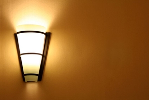 sconce illuminating wall