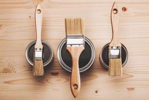 Paint cans and paintbrushes.