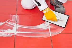 grout being floated in to tile