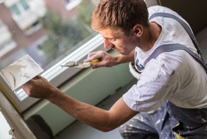 Man glazing a window