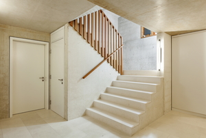 concrete stairs with wooden railing