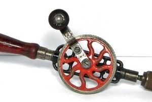 a hand drill on a white background