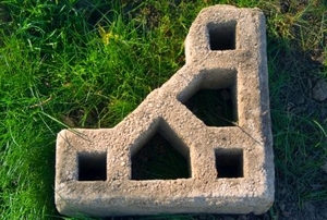 Concrete building block used as a corner, marking the spot.