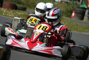 go karts side by side in a race