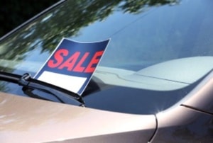sale sign on a car