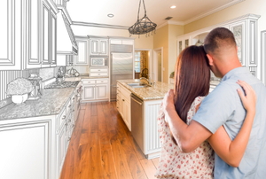 A couple standing in front of a kitchen.