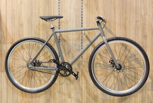 A bike on a wood background.