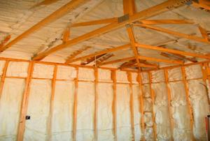 White, spray-in insulation in a new construction.