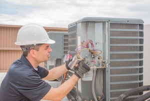 Man working on an air conditioning unit