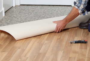 Linoleum being rolled out