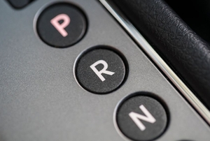 Looking closely at the reverse indicator on a gear shift housing.