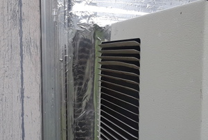 shiny silver tape sealing window air conditioner