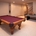A basement with a pool table