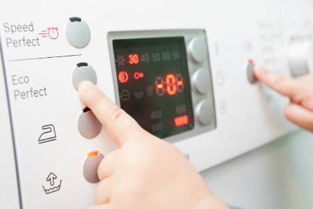 pushing a button on an appliance