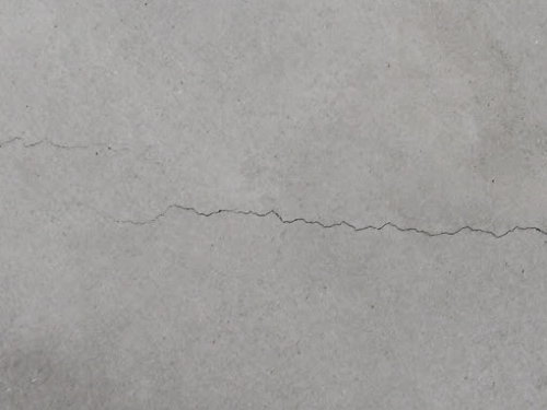 hairline crack in plaster wall