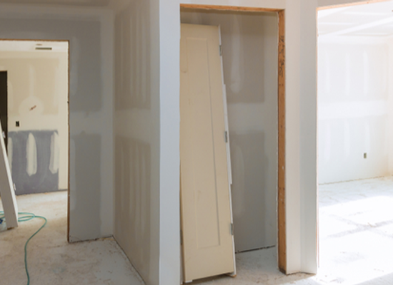 doorways in drywall hallway under construction