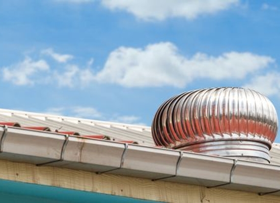 An attic vent with a louvered cover.