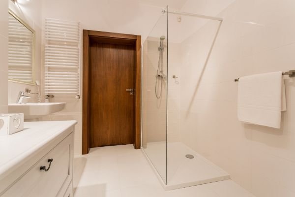 A glass shower in a bathroom.