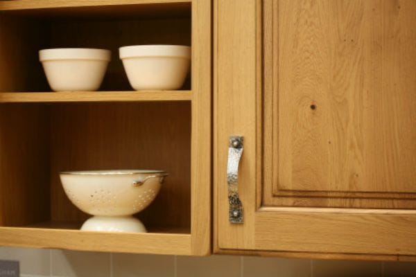 wood cabinets and shelves with white bowls
