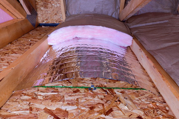 An attic with insulation. 