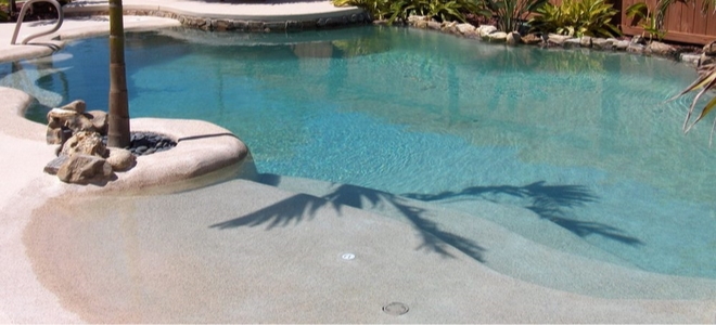 swimming pool with ramp beach entrance