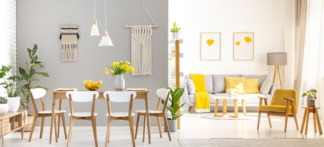 A minimalist living space with pops of yellow.
