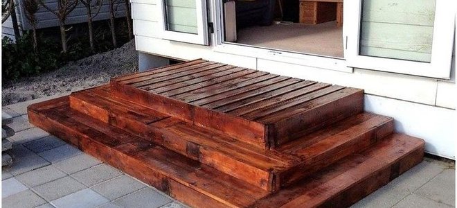 stairs outside a patio door made from pallets