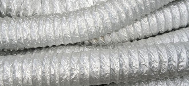 Several tubes of flexible ducting in a pile.
