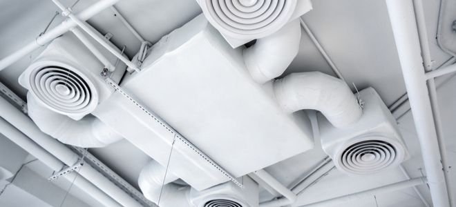 a large ventilation system on a white ceiling