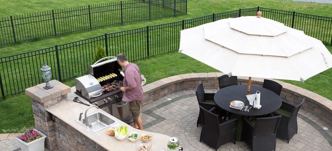 outdoor kitchen, grill, and patio seating