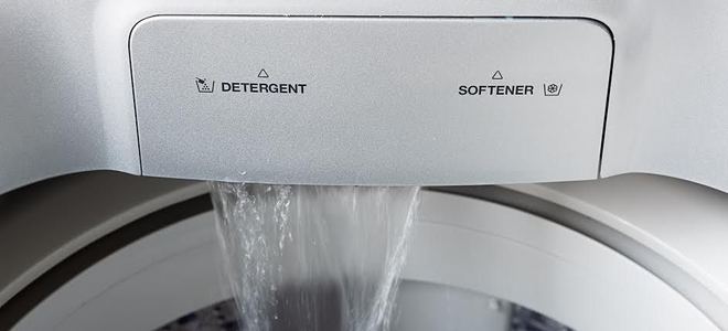 water pouring into a washing machine.