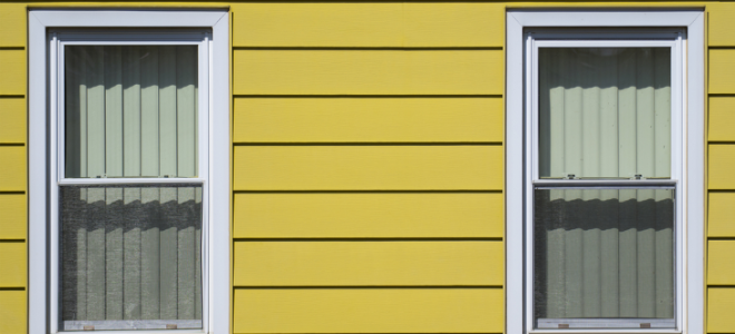 yellow aluminum siding on a house
