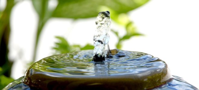 water bubbling out of rock water fountain