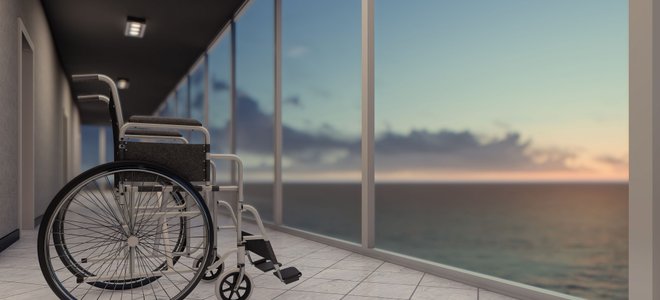 A wheelchair on tile.