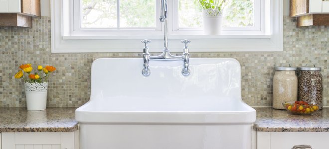 deep white kitchen sink with silver faucet