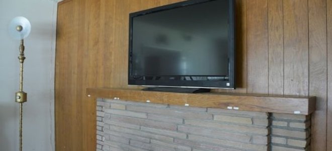 A back wall covered in wood paneling.