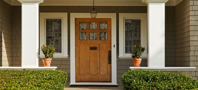 Porch with a heavy, quality wood door