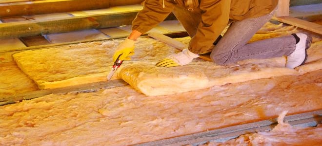 Insulation being installed in an attic. 