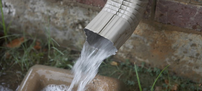 water shooting out of a downspout