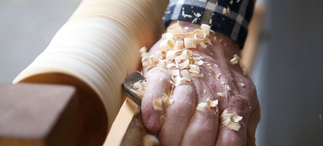 Man working with a wood lathe