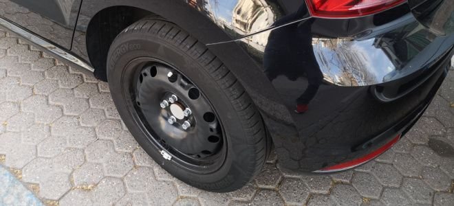 car with missing hubcap