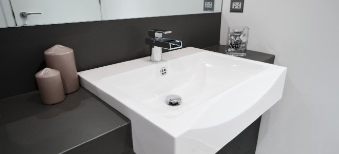 white sink with waterfall faucet